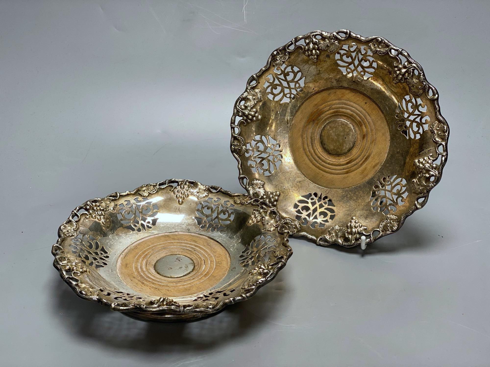 A pair of Victorian silver plated wine coasters, 20cm